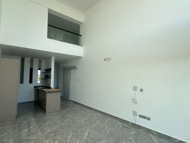 İskele'nin İncisi Boğaz'da Özel Sonsuzluk Havuzlu Hayallerinizi Süsleyen Çatı Teraslı Satılık 2+1 Loft - Fotoğraf 1
