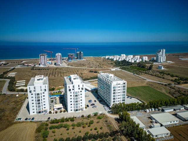 Gaziveren’de En İyi Planlamaya Sahip Denız ve Dag Manzaralı 1+1 Satılık Daire — Çok Uygun Fiyat - Fotoğraf 1